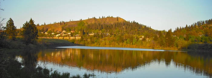 The east end of Mosier is reflected in still waters. Photo by Tim Graves.